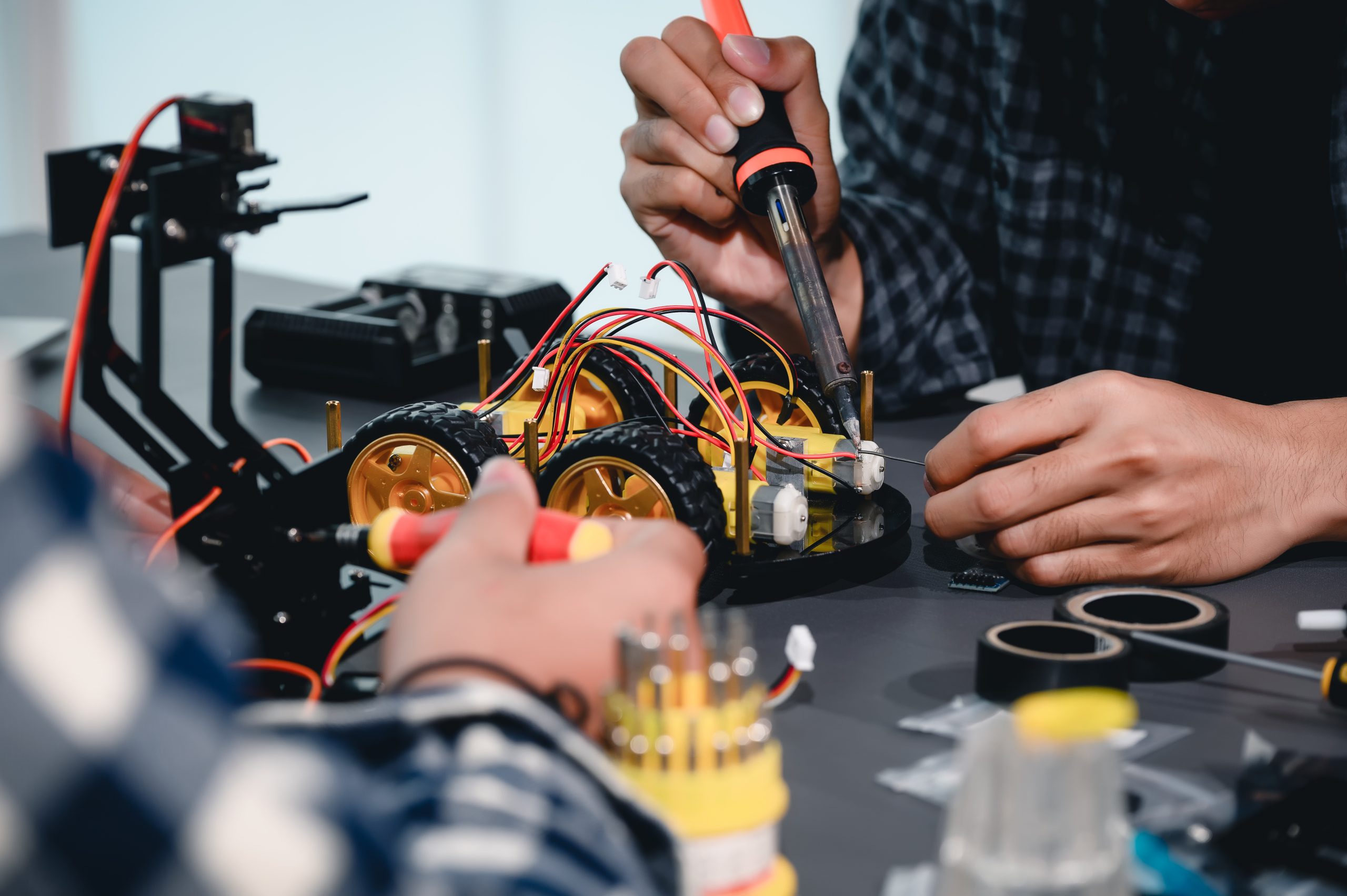 Indian student assembling robotics kit